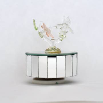 Music box with glass-blown hummingbird.