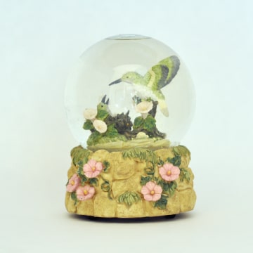 Music box with birds in snowglobe.