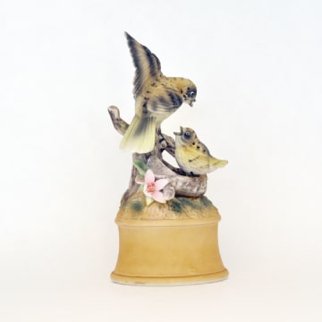 Music box with ceramic birds.