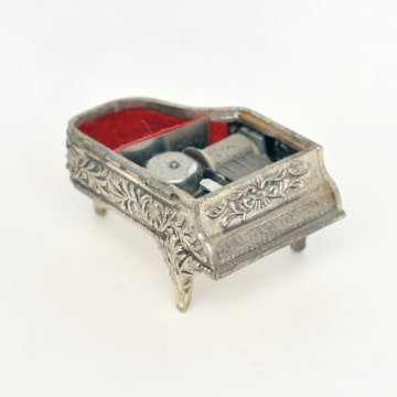 Metal piano music box.