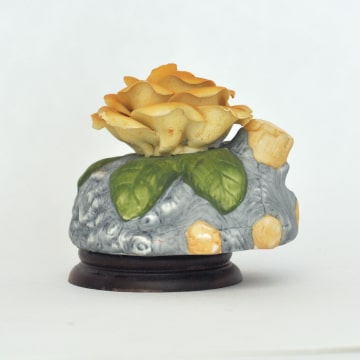 Music box with ceramic rose.